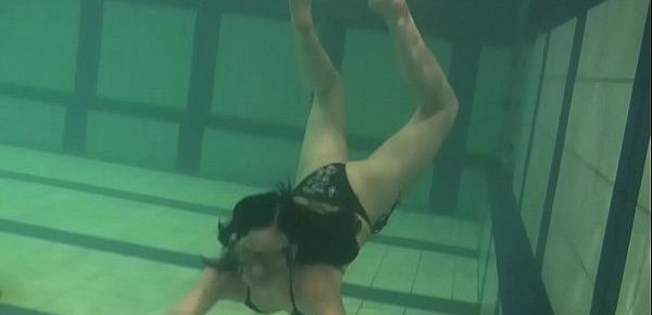  Brunette teen Kristina Andreeva swims naked in the pool